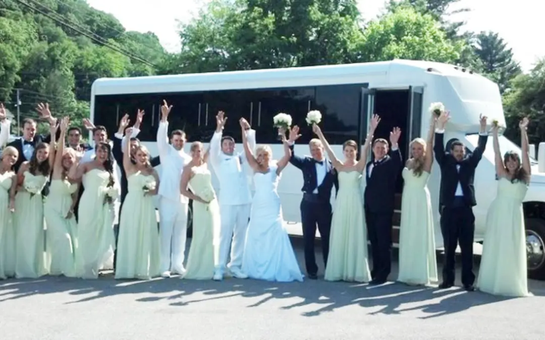 a group of people in white dresses and a bus